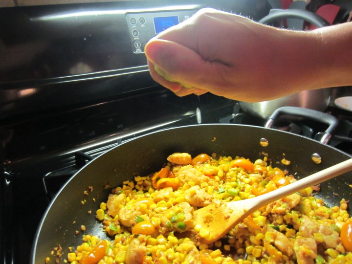 Squeezing the lime half after adding the zest